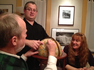 Dave, Glen, and Jamie, clarifying our position on the globe. (Notice Glen's photos of Mayo, Ireland on the wall behind.)