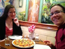 Heather and Shannon share pizza